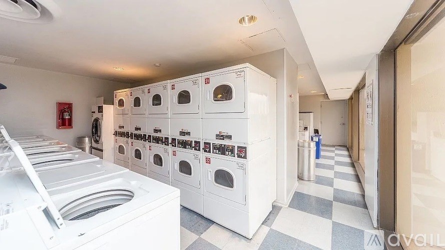 A row of washing machines in a laundromat.