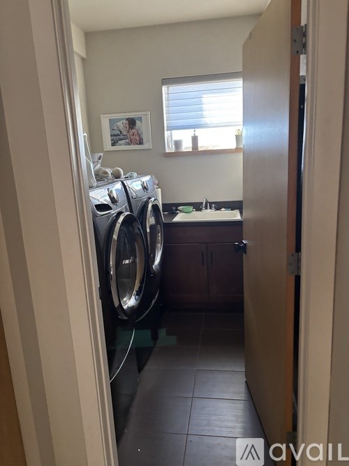 A laundry room with a washer and dryer.