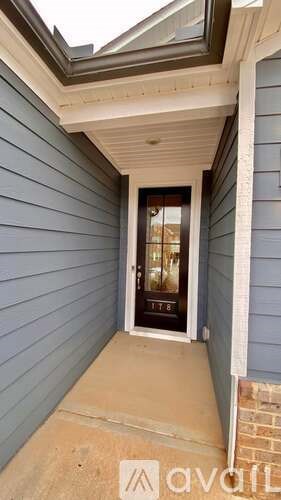 A house number 1178 is visible through the glass door.