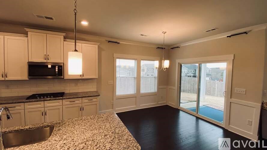 A kitchen with granite countertops and a sink.