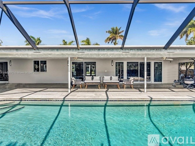 A modern house with a pool in the backyard.