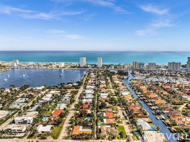 A view of a residential area with a river running through it.