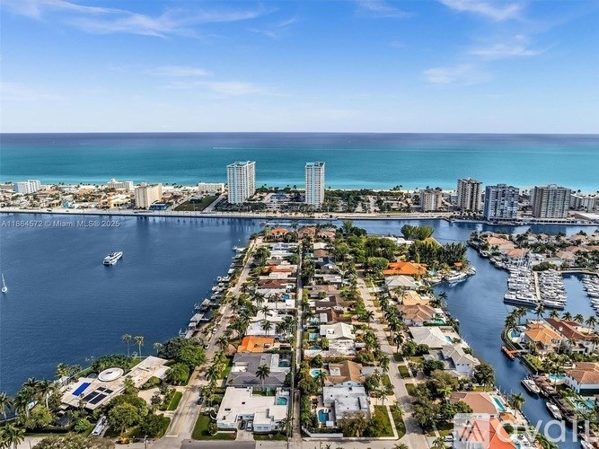 A coastal city with a marina and apartment buildings.