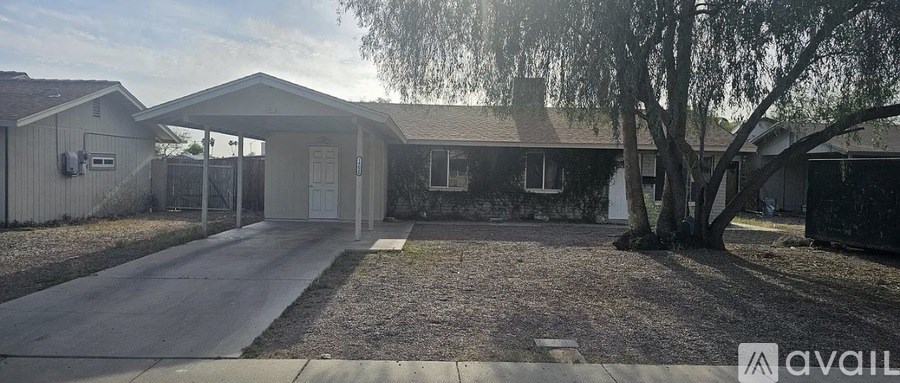 A house with a tree in front of it.