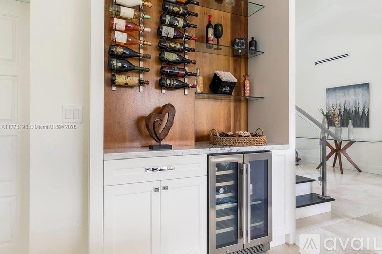 A kitchen with a wine rack and a fridge.