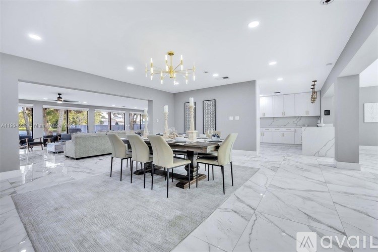 A modern dining room with a large table and chairs.