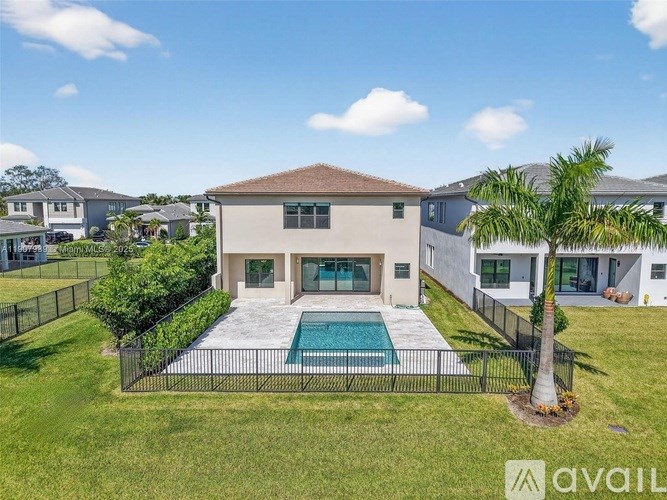 A house with a pool in the backyard.