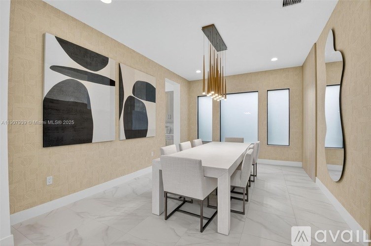 A modern dining room with a large abstract painting on the wall.