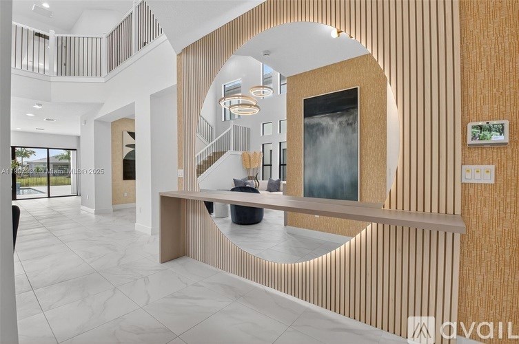 A modern interior space with a circular design element and a large window.