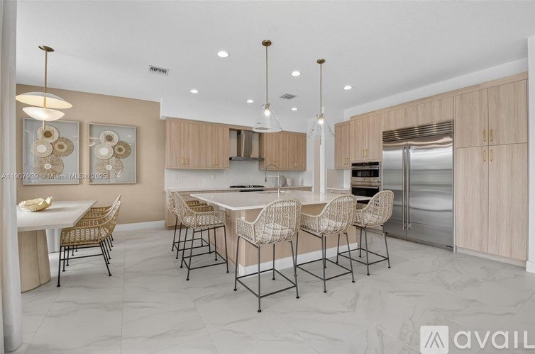 A modern kitchen with a dining table set for four.