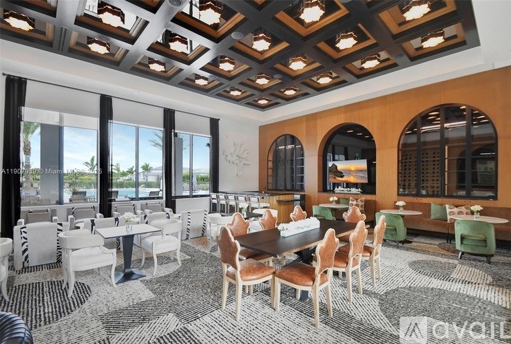 A modern dining room with a large table surrounded by chairs.