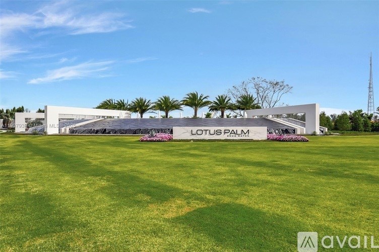 A large white building with the words Lotus Palm on it.