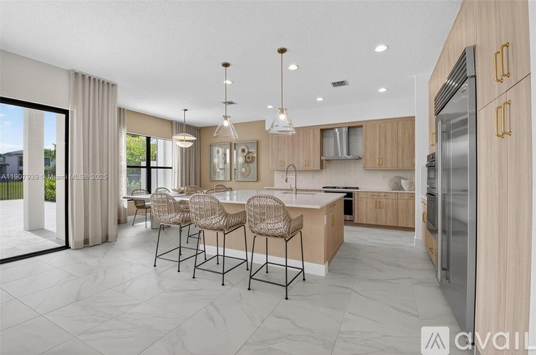 A modern kitchen with a dining table and chairs.
