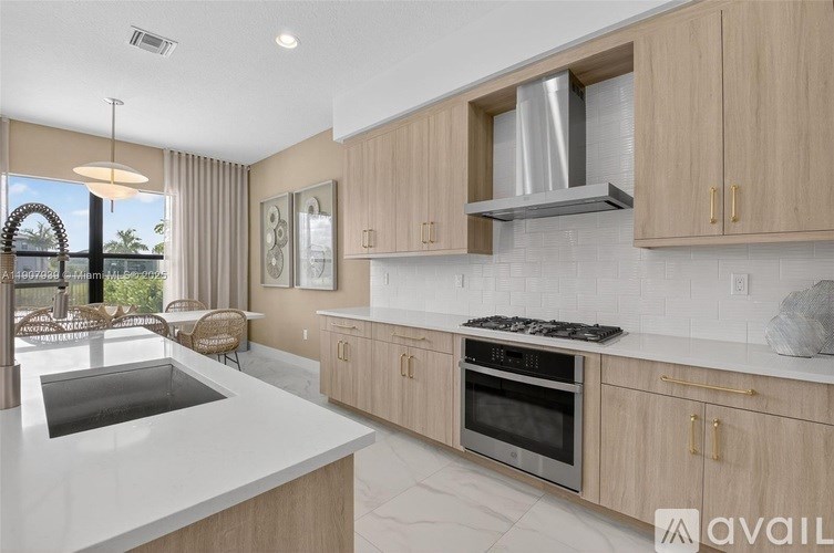 A modern kitchen with wooden cabinets and a stainless steel range hood.