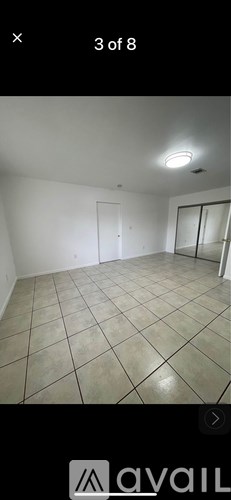 A room with white walls and a tiled floor.