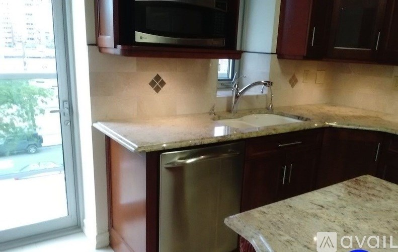 A kitchen with a sink and a window.