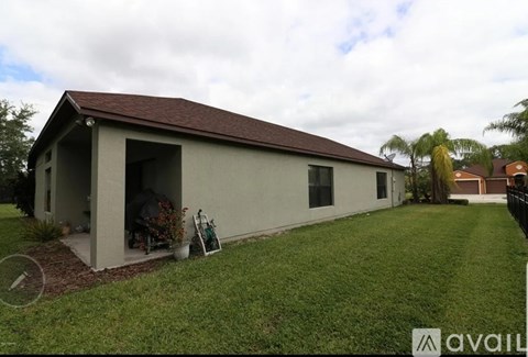 A house with a brown roof and a white exterior is available for sale.
