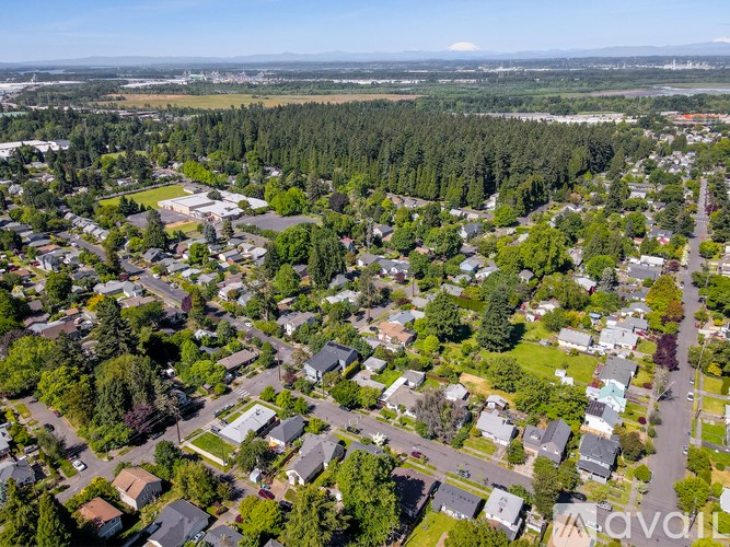 A bird's eye view of a residential area with houses and trees.
