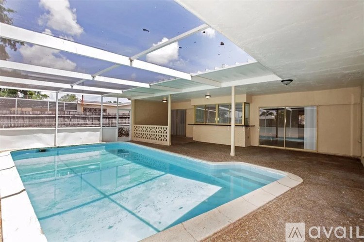 A swimming pool with a glass bottom and a white ceiling.