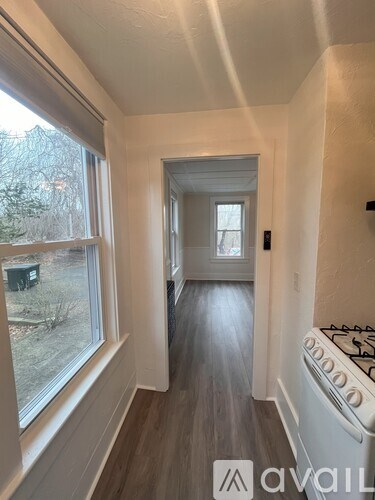 A room with a window and a stove.