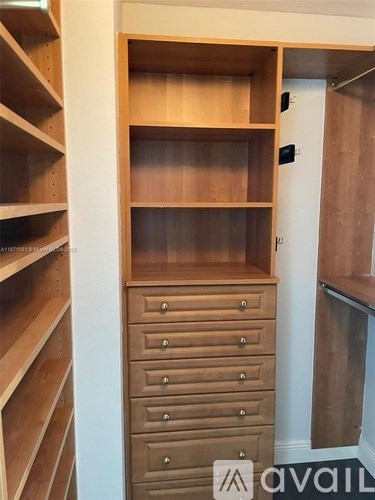 A wooden shelving unit with drawers is available for rent.
