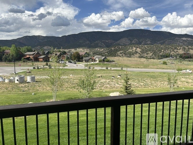 A mountain range is in the background of a suburban neighborhood.