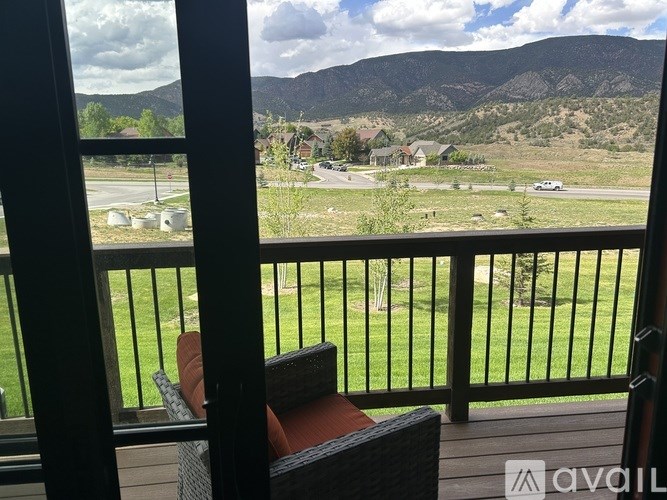 A balcony view of a mountain landscape.