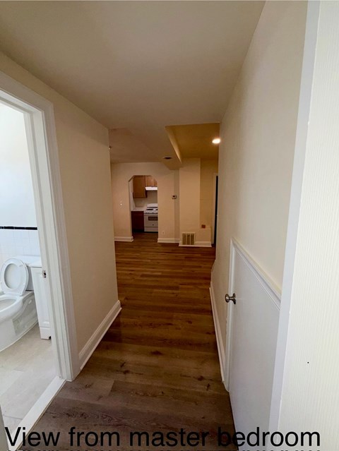 A view from the master bedroom looking down a hallway.