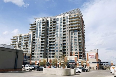 A large building with a lot of windows is in the background.
