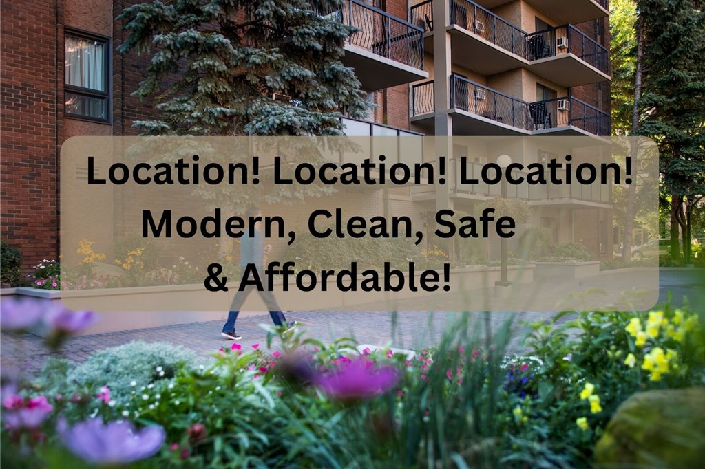 A person is walking in a garden with a building in the background.