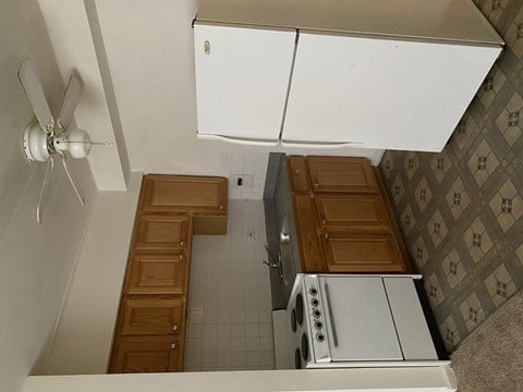 an overhead view of a kitchen with a stove and cabinets