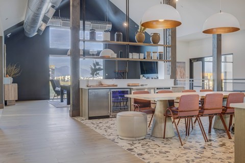 A modern dining area with a large table and chairs.