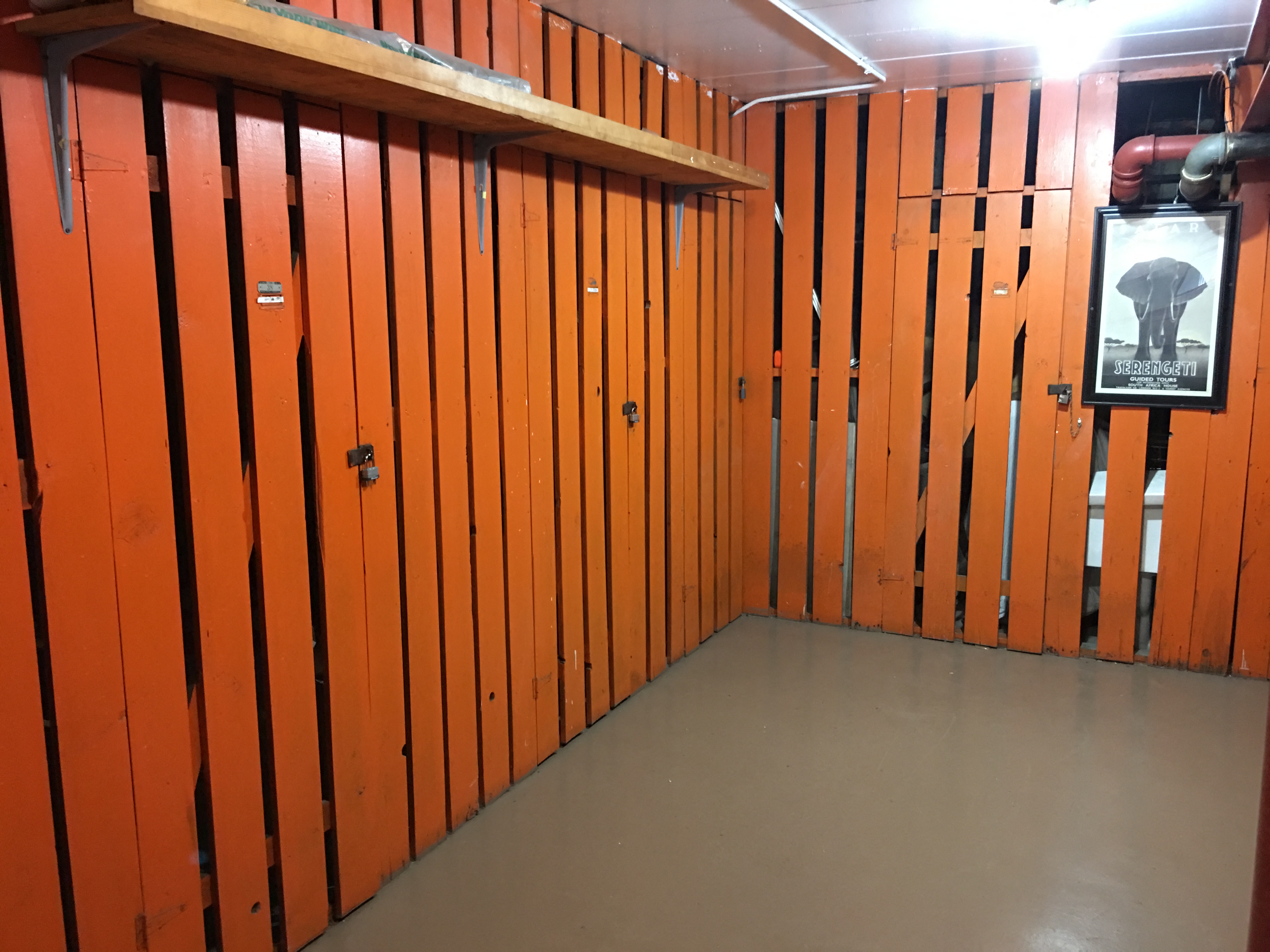 a room with wooden walls and a sign on the wall