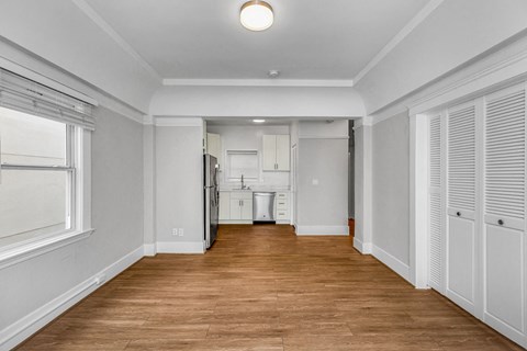 A room with wooden floors and white walls.