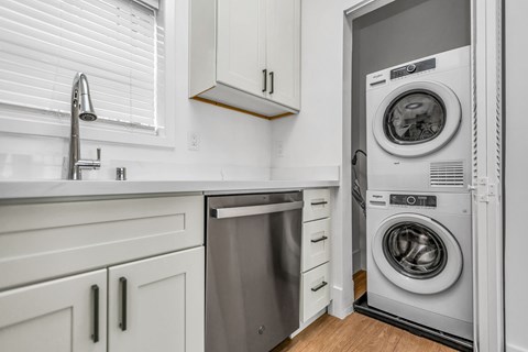 A modern laundry room with a washer and dryer.