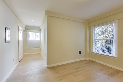 A room with a window and a door.