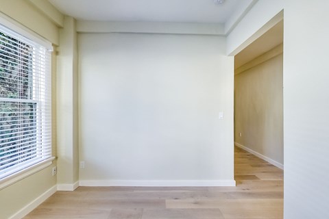 A room with a window and a door.