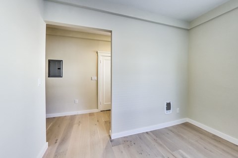 A room with a doorway leading to another room.