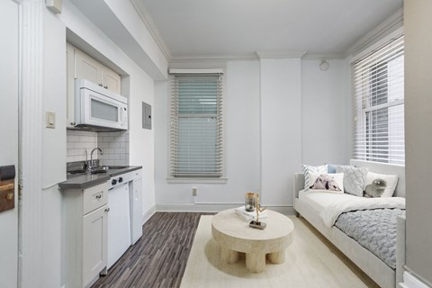 A small white kitchen with a microwave above the stove.
