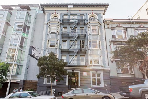 A building with a fire escape on the side.