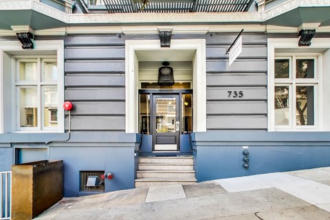 A grey building with the number 735 on it.