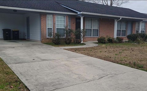 A house with a grey roof and a grey garage door.