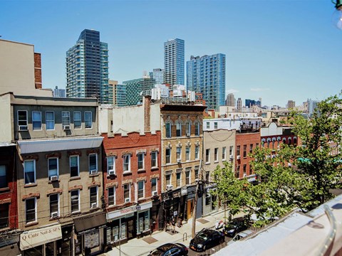 the view of the city from the roof of a building