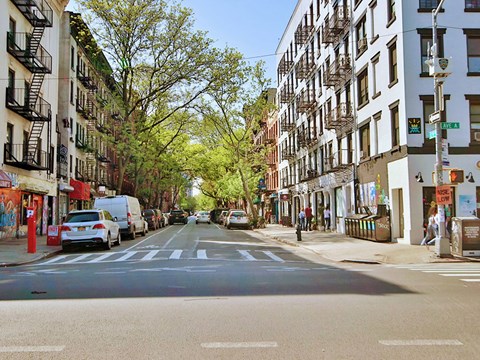 a city street with cars parked on the side of it