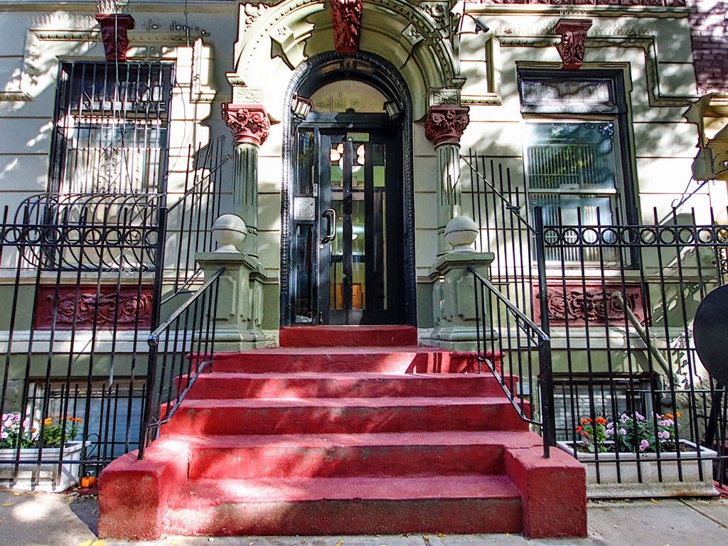 a red staircase in front of a building