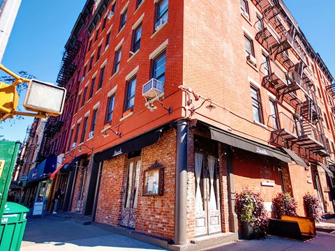 a brick building on the corner of a street