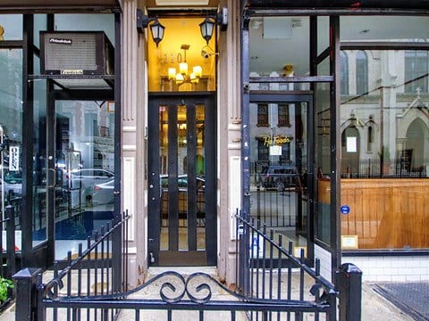 the entrance of a restaurant with glass doors