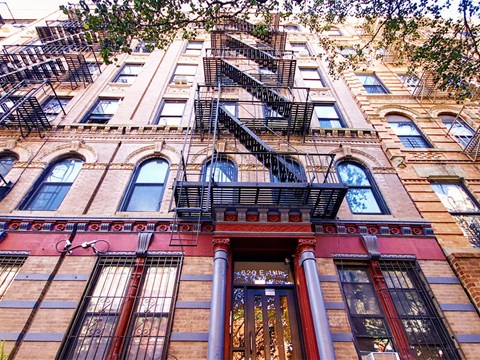 a tall building with a fire escape on the side of it