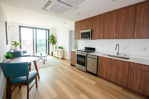 A kitchen with wooden cabinets and a white countertop.