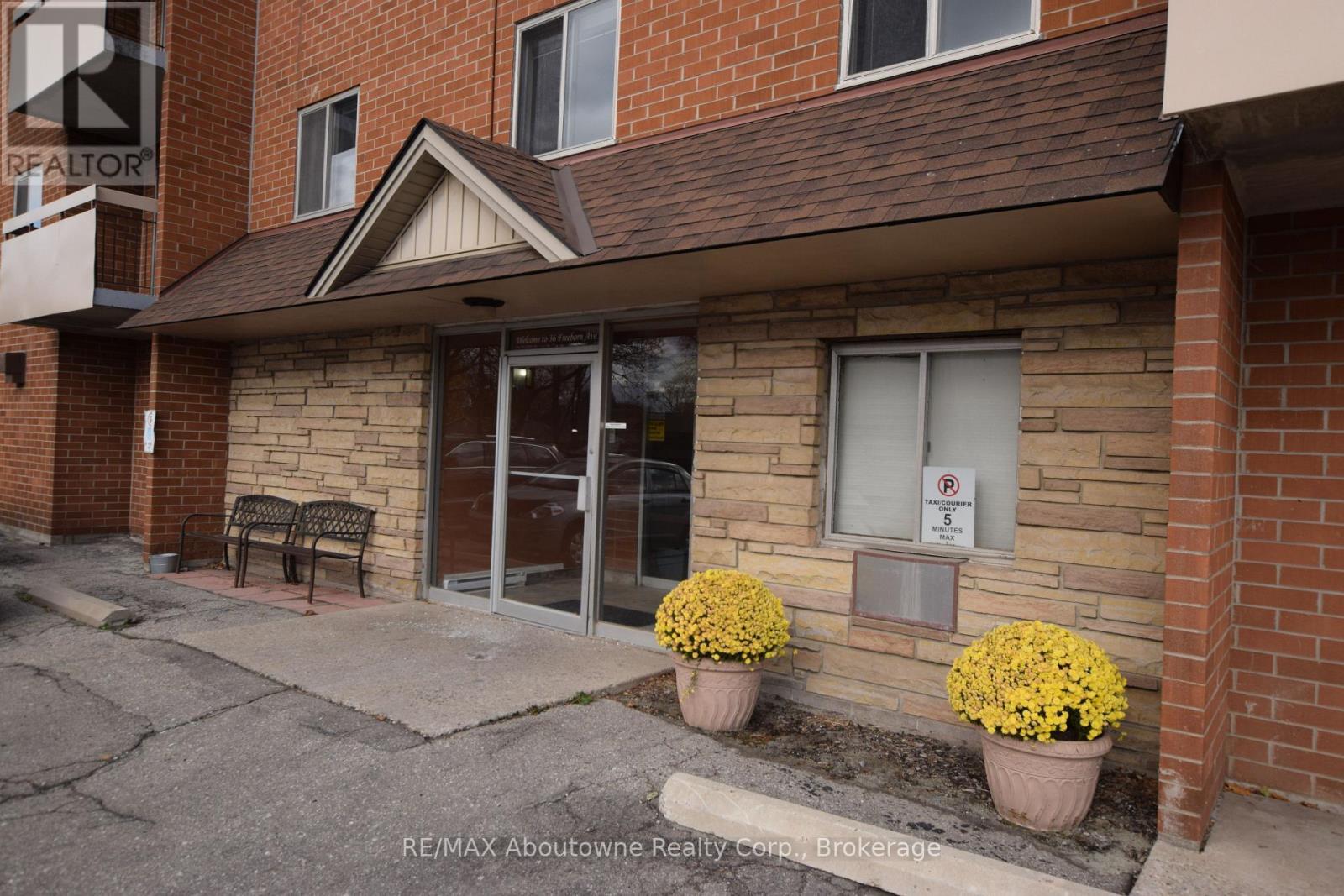 A building with a sign that says RE/MAX Aboutowne Realty Corp Brokerage.